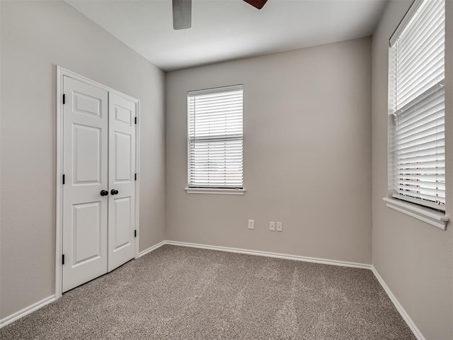 3004 Twin Lake Dr, Moore, OK 73165 - unfurnished bedroom featuring carpet and a ceiling fan