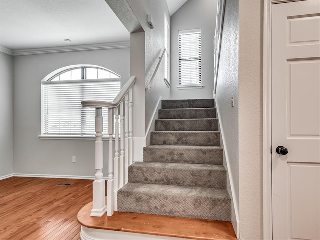 3004 Twin Lake Dr, Moore, OK 73165 - staircase with wood finished floors and ornamental molding