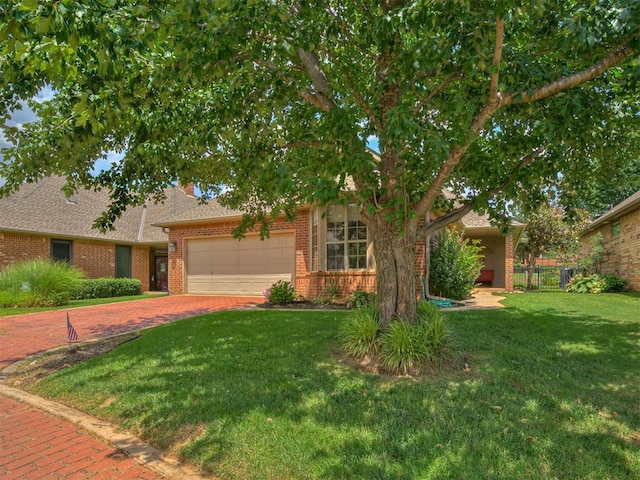 3924 Prairie Hill Ct, Edmond, OK 73003 - obstructed view of property featuring brick siding, a garage, driveway, and a shingled roof