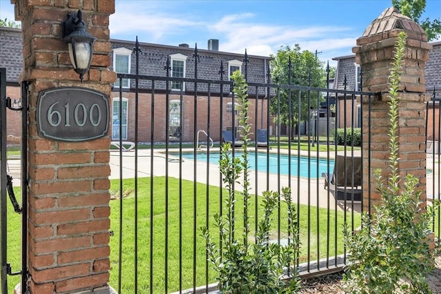 6100 N Brookline Ave Unit 2, Oklahoma City, OK 73112 - gate featuring a community pool
