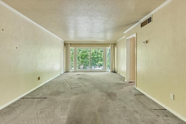 6100 N Brookline Ave Unit 2, Oklahoma City, OK 73112 - carpeted spare room featuring crown molding, a textured ceiling, and a textured wall