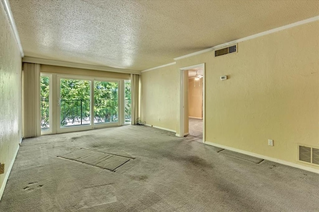6100 N Brookline Ave Unit 2, Oklahoma City, OK 73112 - carpeted empty room with a textured ceiling, crown molding, and a textured wall