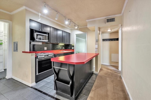 6100 N Brookline Ave Unit 2, Oklahoma City, OK 73112 - kitchen with stainless steel appliances, ornamental molding, dark cabinetry, backsplash, and a center island