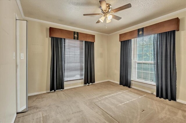 6100 N Brookline Ave Unit 2, Oklahoma City, OK 73112 - empty room featuring ornamental molding, carpet, a textured ceiling, and ceiling fan