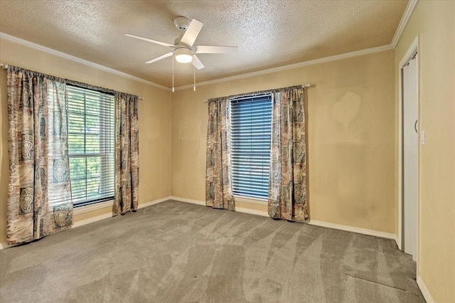 6100 N Brookline Ave Unit 2, Oklahoma City, OK 73112 - unfurnished room with a textured ceiling, crown molding, carpet floors, and ceiling fan