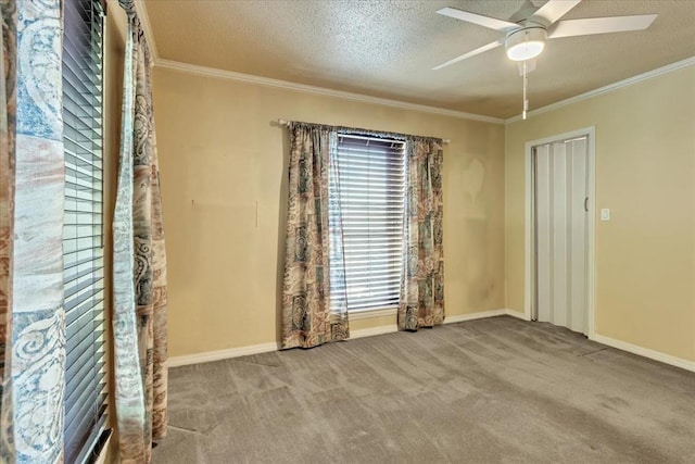 6100 N Brookline Ave Unit 2, Oklahoma City, OK 73112 - unfurnished room with carpet flooring, a ceiling fan, crown molding, and a textured ceiling