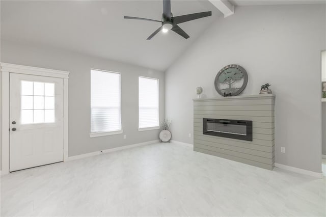 219 SE 45th St, Oklahoma City, OK 73129 - unfurnished living room featuring a glass covered fireplace and ceiling fan