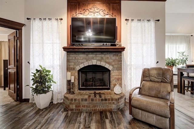 10633 NW 38th St, Yukon, OK 73099 - living room with wood finished floors and a brick fireplace