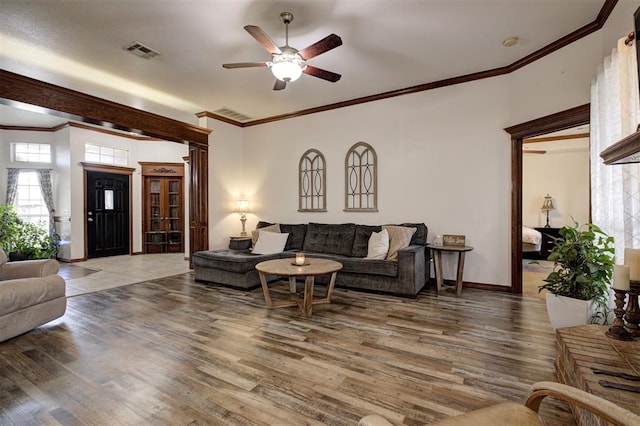 10633 NW 38th St, Yukon, OK 73099 - living area featuring a ceiling fan, wood finished floors, and ornamental molding