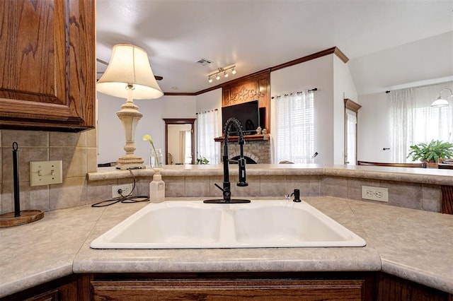 10633 NW 38th St, Yukon, OK 73099 - kitchen featuring light countertops and tasteful backsplash