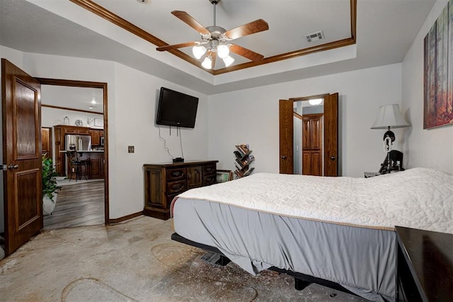 10633 NW 38th St, Yukon, OK 73099 - bedroom with a raised ceiling, ceiling fan, and stainless steel fridge