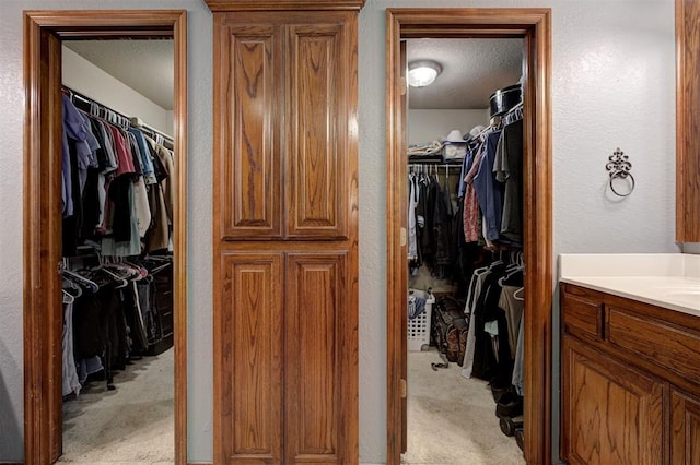 10633 NW 38th St, Yukon, OK 73099 - walk in closet featuring light carpet