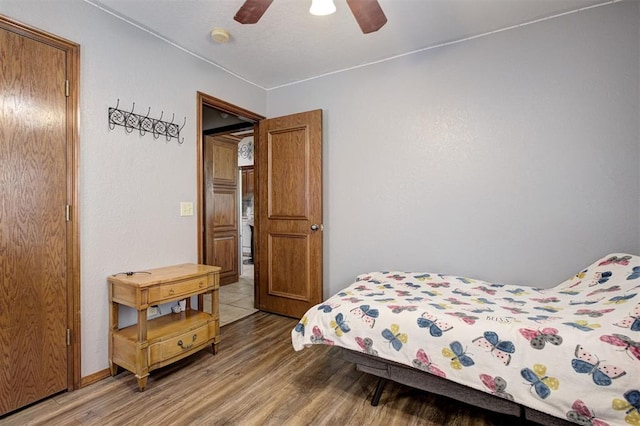 10633 NW 38th St, Yukon, OK 73099 - bedroom with wood finished floors and ceiling fan