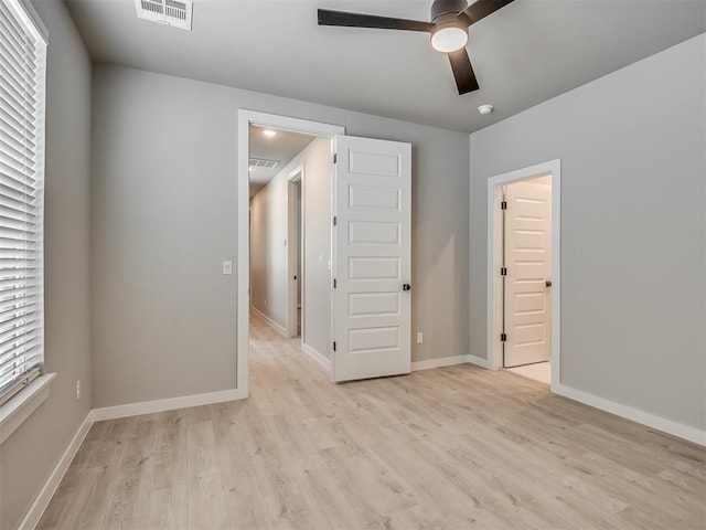 609 W 2nd St, Edmond, OK 73003 - unfurnished bedroom featuring light wood-style floors and a ceiling fan