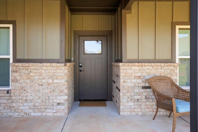 9228 NW 144th Pl, Yukon, OK 73099 - entrance to property with board and batten siding and brick siding