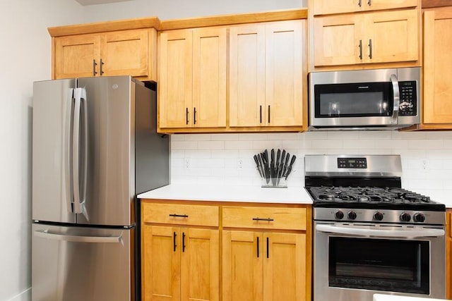 9228 NW 144th Pl, Yukon, OK 73099 - kitchen with appliances with stainless steel finishes, light countertops, and backsplash