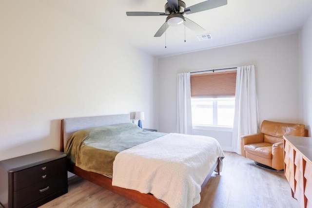 9228 NW 144th Pl, Yukon, OK 73099 - bedroom with light wood-style floors and ceiling fan