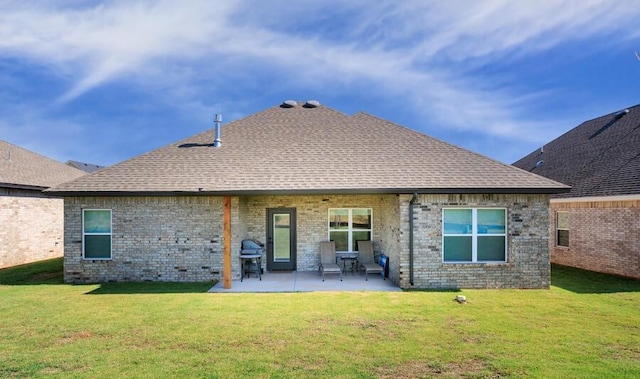 9228 NW 144th Pl, Yukon, OK 73099 - rear view of property with brick siding, a lawn, a patio area, and a shingled roof