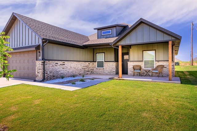 9228 NW 144th Pl, Yukon, OK 73099 - view of front of house with an attached garage, a front yard, driveway, roof with shingles, and board and batten siding