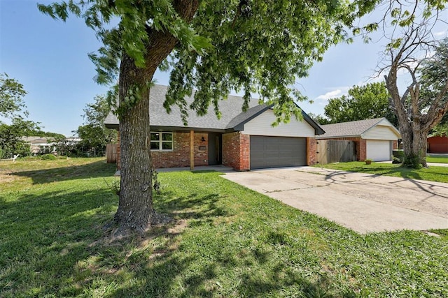 1317 E Boyd St, Norman, OK 73071 - view of front of property with brick siding, a front yard, a garage, and concrete driveway