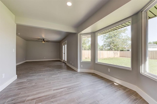 1317 E Boyd St, Norman, OK 73071 - spare room featuring a ceiling fan, wood finished floors, and recessed lighting