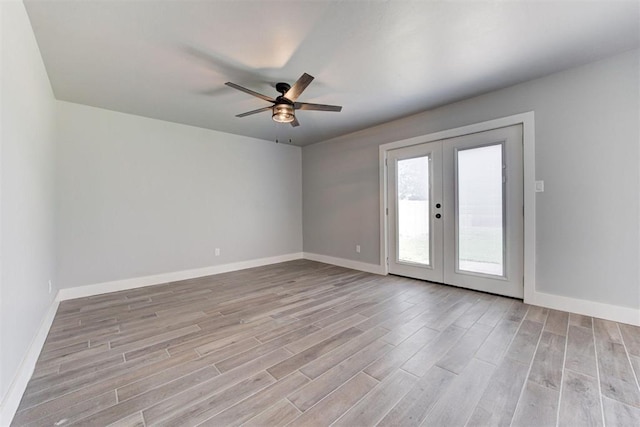 1317 E Boyd St, Norman, OK 73071 - unfurnished room featuring wood finished floors, ceiling fan, and french doors