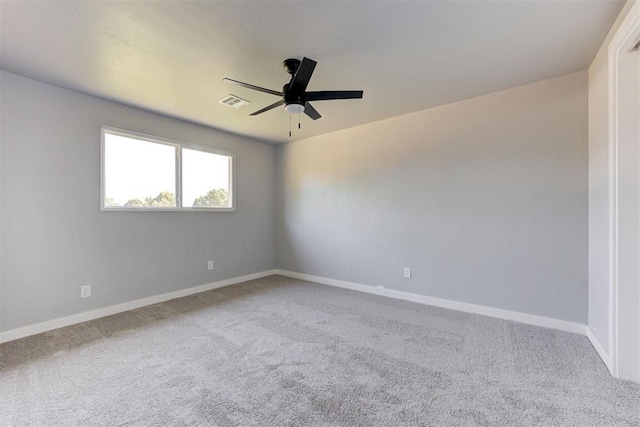 1317 E Boyd St, Norman, OK 73071 - empty room featuring carpet floors and a ceiling fan