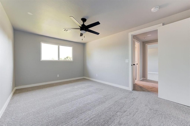 1317 E Boyd St, Norman, OK 73071 - carpeted empty room featuring ceiling fan and a smoke detector
