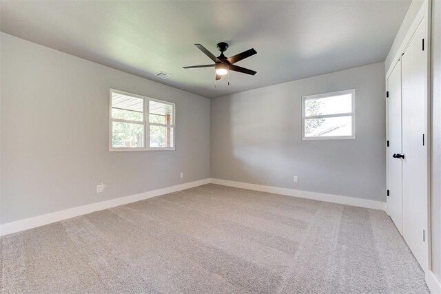 1317 E Boyd St, Norman, OK 73071 - unfurnished room with plenty of natural light, ceiling fan, and light carpet