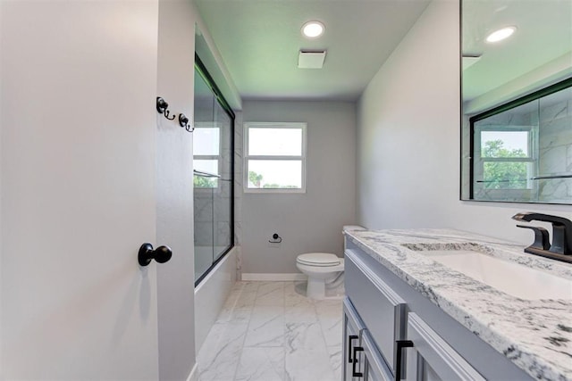 1317 E Boyd St, Norman, OK 73071 - full bath featuring marble look tile flooring, vanity, shower / bath combination with glass door, and recessed lighting