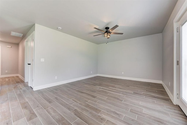 1317 E Boyd St, Norman, OK 73071 - spare room featuring light wood finished floors, ceiling fan, and healthy amount of natural light