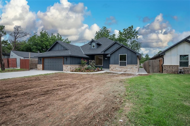 2705 NW 40th St, Oklahoma City, OK 73112 - view of front of property with brick siding, driveway, a shingled roof, and an attached garage