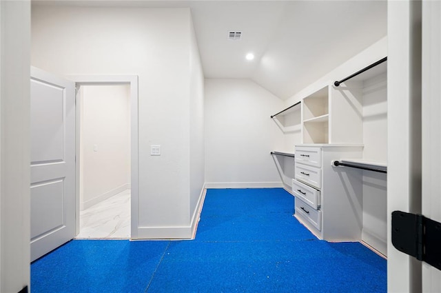 2705 NW 40th St, Oklahoma City, OK 73112 - spacious closet with lofted ceiling and marble look tile flooring