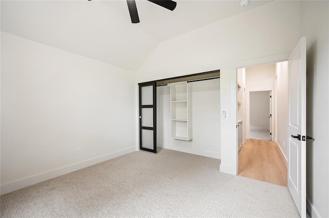 2705 NW 40th St, Oklahoma City, OK 73112 - unfurnished bedroom featuring light colored carpet, vaulted ceiling, a ceiling fan, and a closet