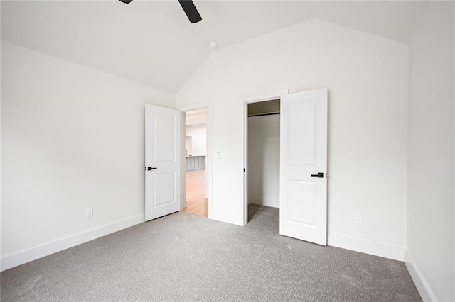 2705 NW 40th St, Oklahoma City, OK 73112 - unfurnished bedroom with carpet flooring, vaulted ceiling, a ceiling fan, and a spacious closet
