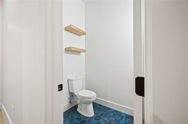 2705 NW 40th St, Oklahoma City, OK 73112 - bathroom with toilet and tile patterned floors