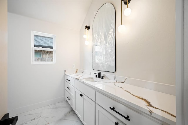 2705 NW 40th St, Oklahoma City, OK 73112 - bathroom featuring double vanity and marble look tiles