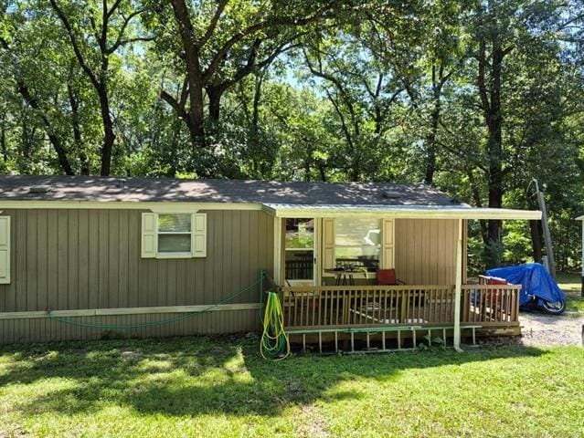 2908 Harber Loop, Grove, OK 74020 - rear view of house featuring a lawn