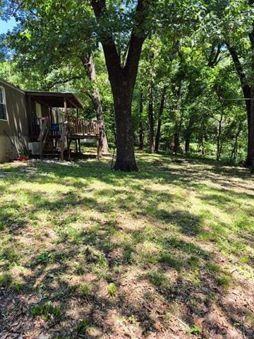 2908 Harber Loop, Grove, OK 74020 - view of green lawn featuring a wooden deck