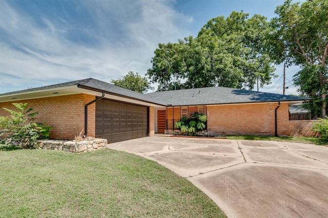 3325 NW 65th St Unit 4057723241, Oklahoma City, OK 73116 - view of front of property featuring brick siding, driveway, and an attached garage
