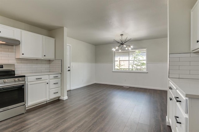 3325 NW 65th St Unit 4057723241, Oklahoma City, OK 73116 - kitchen featuring stainless steel electric range oven, light countertops, a chandelier, white cabinets, and under cabinet range hood