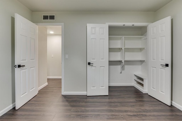 3325 NW 65th St Unit 4057723241, Oklahoma City, OK 73116 - unfurnished bedroom with dark wood-style flooring, a closet, and recessed lighting