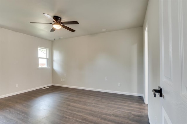 3325 NW 65th St Unit 4057723241, Oklahoma City, OK 73116 - spare room featuring a ceiling fan and dark wood-style floors