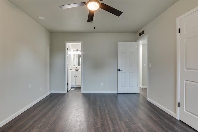 3325 NW 65th St Unit 4057723241, Oklahoma City, OK 73116 - unfurnished bedroom featuring dark wood finished floors, ensuite bath, and ceiling fan