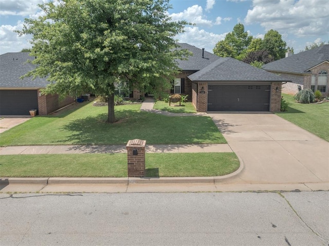 2725 NW 162nd St, Edmond, OK 73013 - view of front of home with brick siding, concrete driveway, a front yard, and a garage