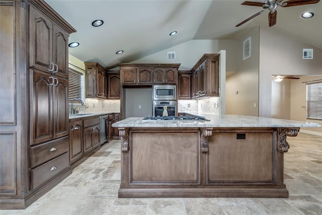 6704 Tall Oaks Dr, Oklahoma City, OK 73127 - kitchen featuring stainless steel appliances, ceiling fan, lofted ceiling, backsplash, and light stone finish flooring