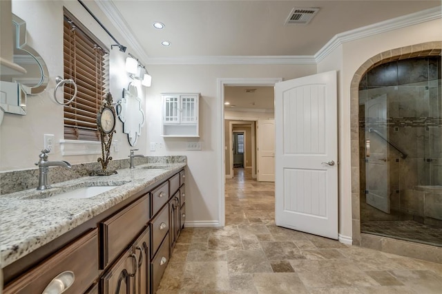 6704 Tall Oaks Dr, Oklahoma City, OK 73127 - full bathroom featuring double vanity, crown molding, a stall shower, stone finish flooring, and recessed lighting