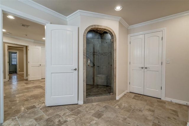 6704 Tall Oaks Dr, Oklahoma City, OK 73127 - hallway featuring stone finish flooring, ornamental molding, and recessed lighting