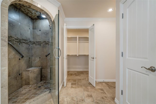 6704 Tall Oaks Dr, Oklahoma City, OK 73127 - bathroom with a stall shower, a walk in closet, ornamental molding, stone finish floors, and recessed lighting