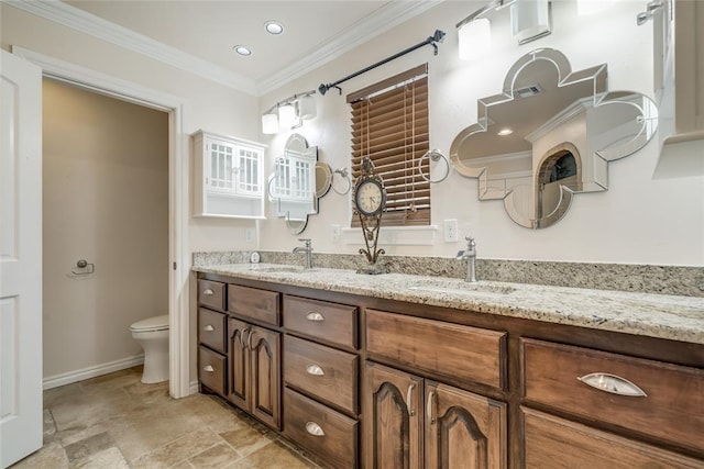 6704 Tall Oaks Dr, Oklahoma City, OK 73127 - bathroom with double vanity, crown molding, stone finish floors, and recessed lighting